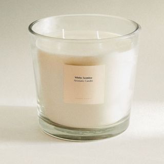 A Zara scented candle in a clear glass vessel for Zara Home's summer sale.