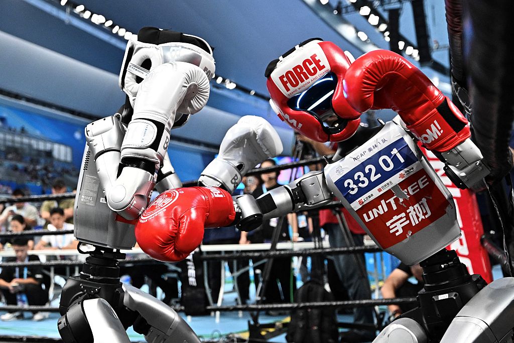 Robots compete in a boxing event during the World Humanoid Robots Games in Beijing