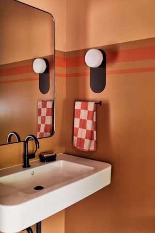 an orange small bathroom
