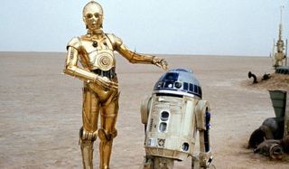Star Wars C3PO and R2-D2 standing in the desert