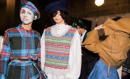 Models wearing clothing and hats by Charles Jeffrey