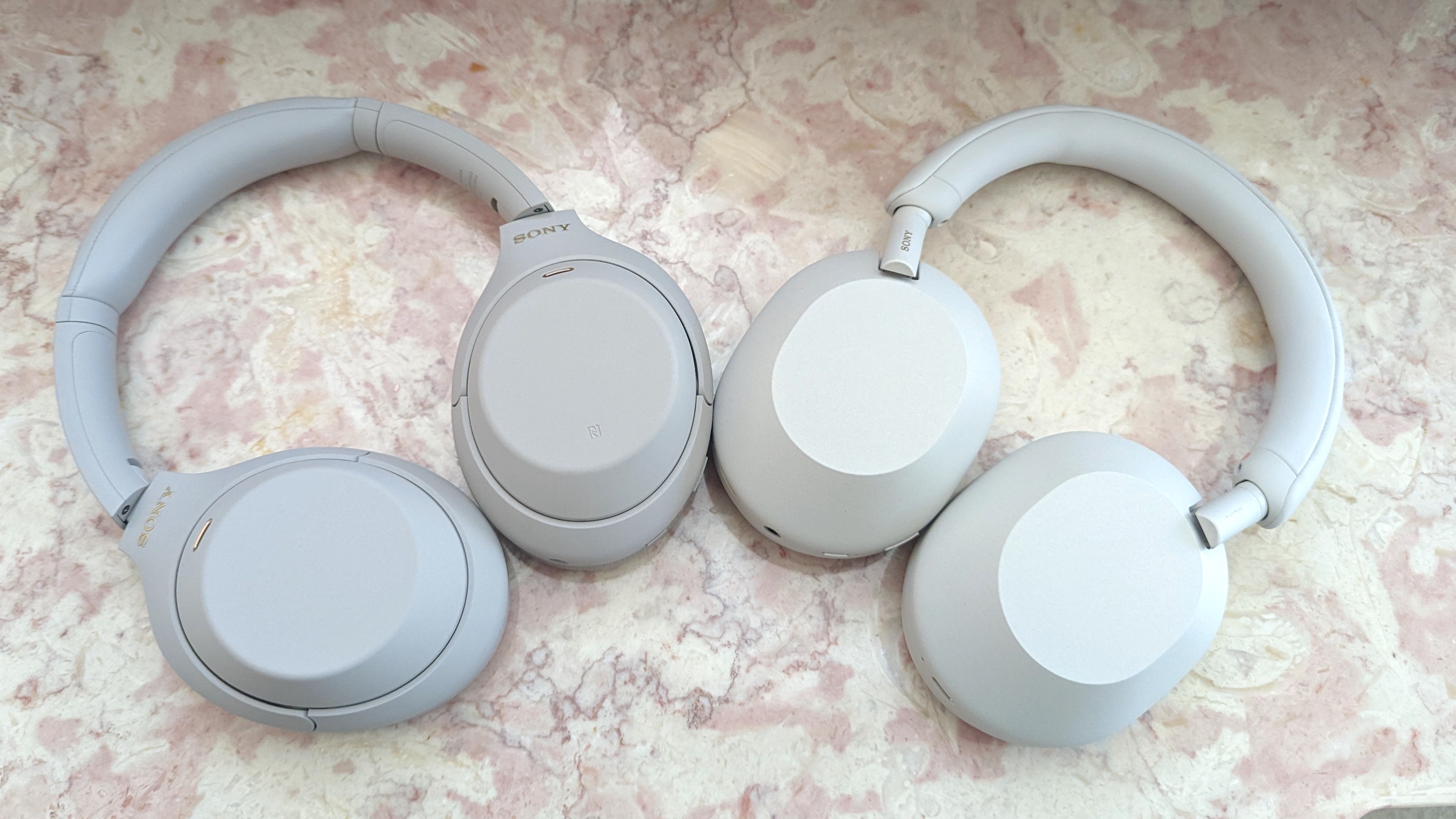 The Sony WH-1000XM4 (left) and Sony WH-1000XM5 (right) noise-cancelling headphones sitting next to each other