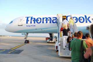 Passengers boarding a Thomas Cook plane