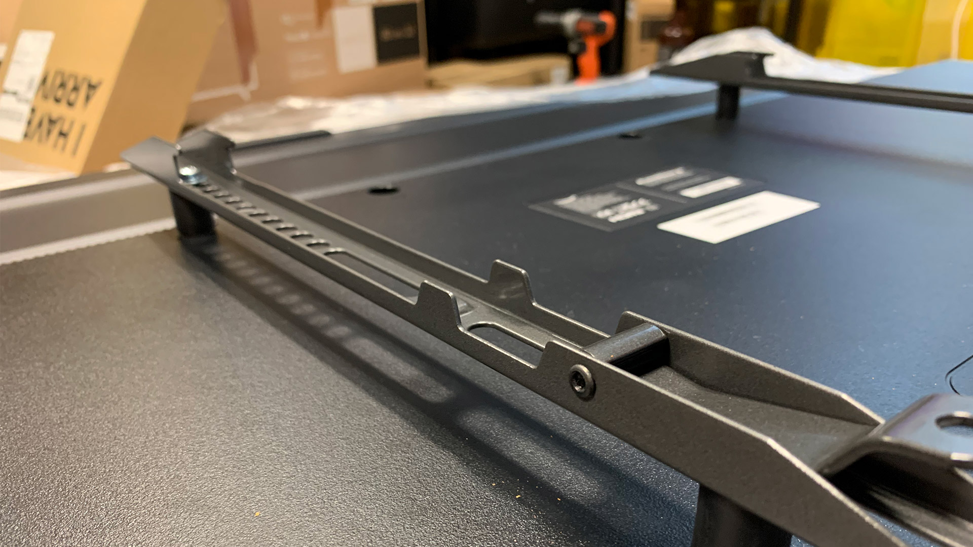 The Echogear EGLF3 brackets mounted to the back of a TV