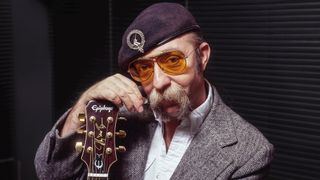Jeff "Skunk" Baxter poses with an Epiphone guitar
