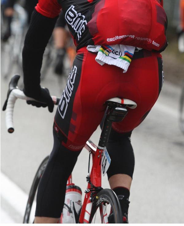 The World Champion's jacket tucked under a domestique's jacket