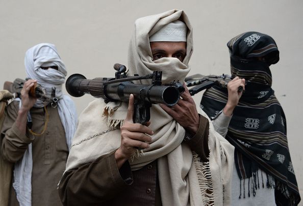 Former Taliban fighters turn in their weapons