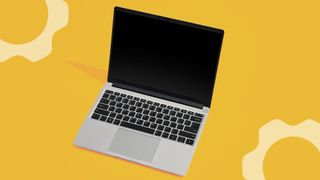 The 2025 Framework Laptop 13 with lid open in front of an abstract yellow background