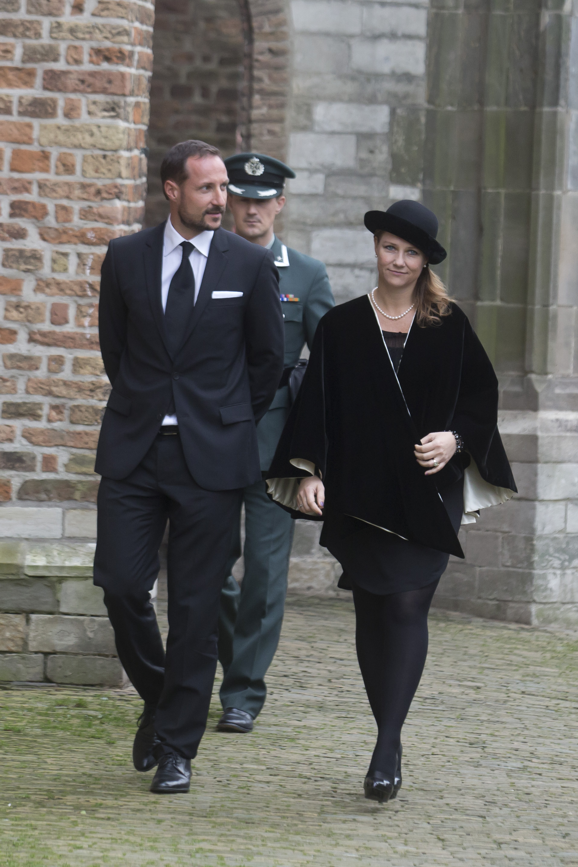 Crown Prince Haakon and Princess Martha Louise walking in black outfits
