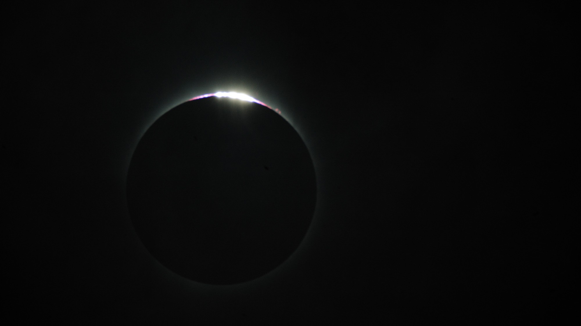 a thin crescent of light is visible during total solar eclipse