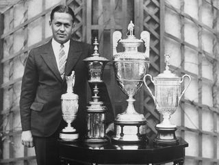 Golfer Bobby Jones with the trophies that made up the Grand Slam