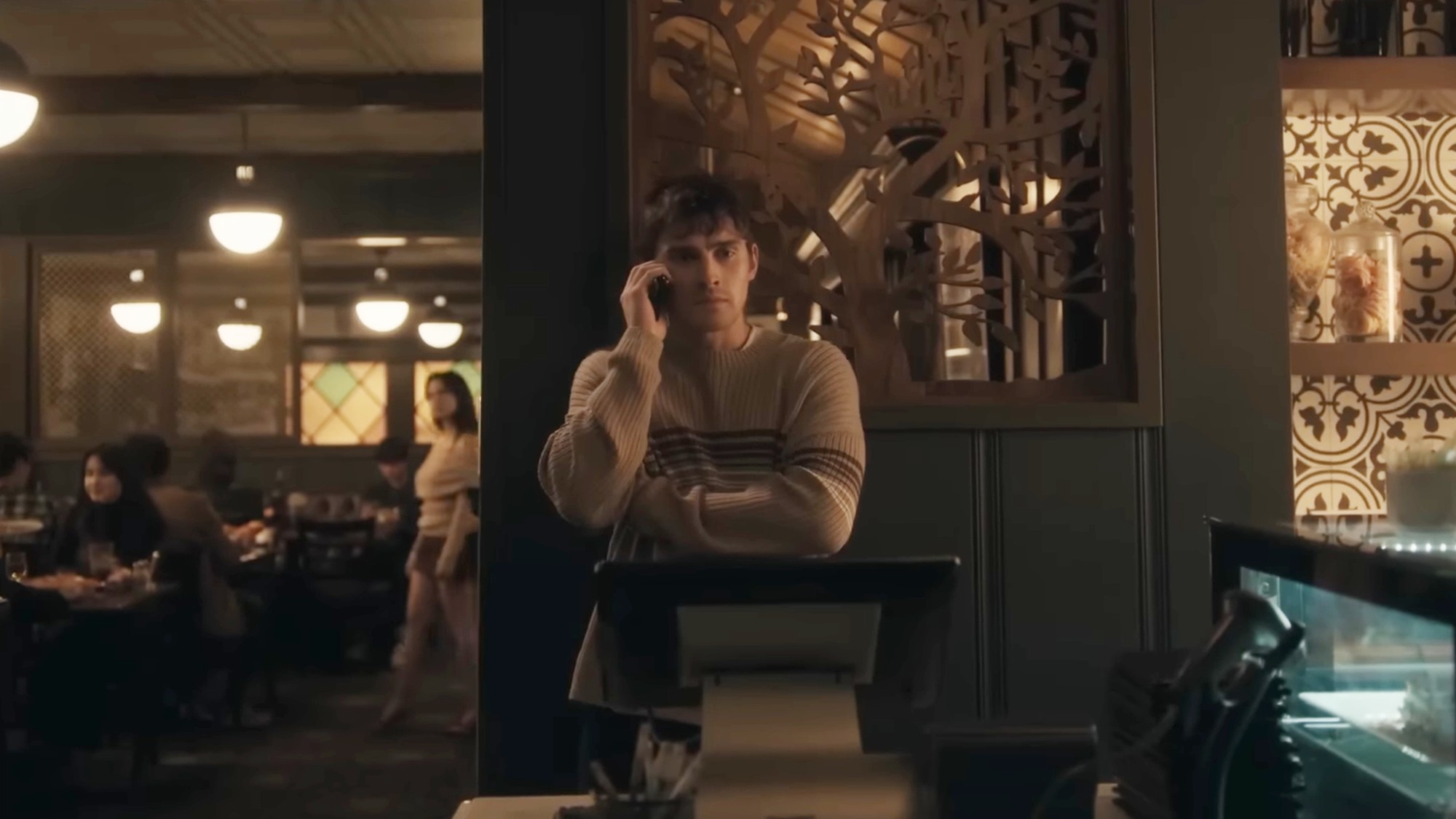 Michael Johnston talking on the phone in Obsession.
