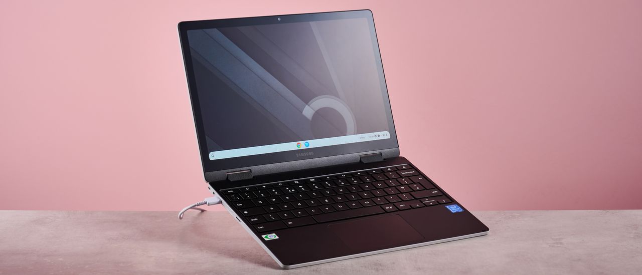 Samsung Galaxy Chromebook 2 360 open on desk with pink background
