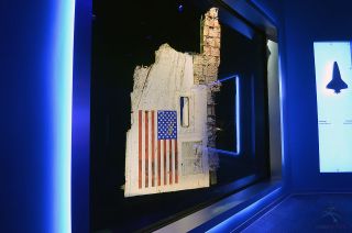 A section of the fuselage recovered from NASA's space shuttle Challenger displayed in "Forever Remembered."