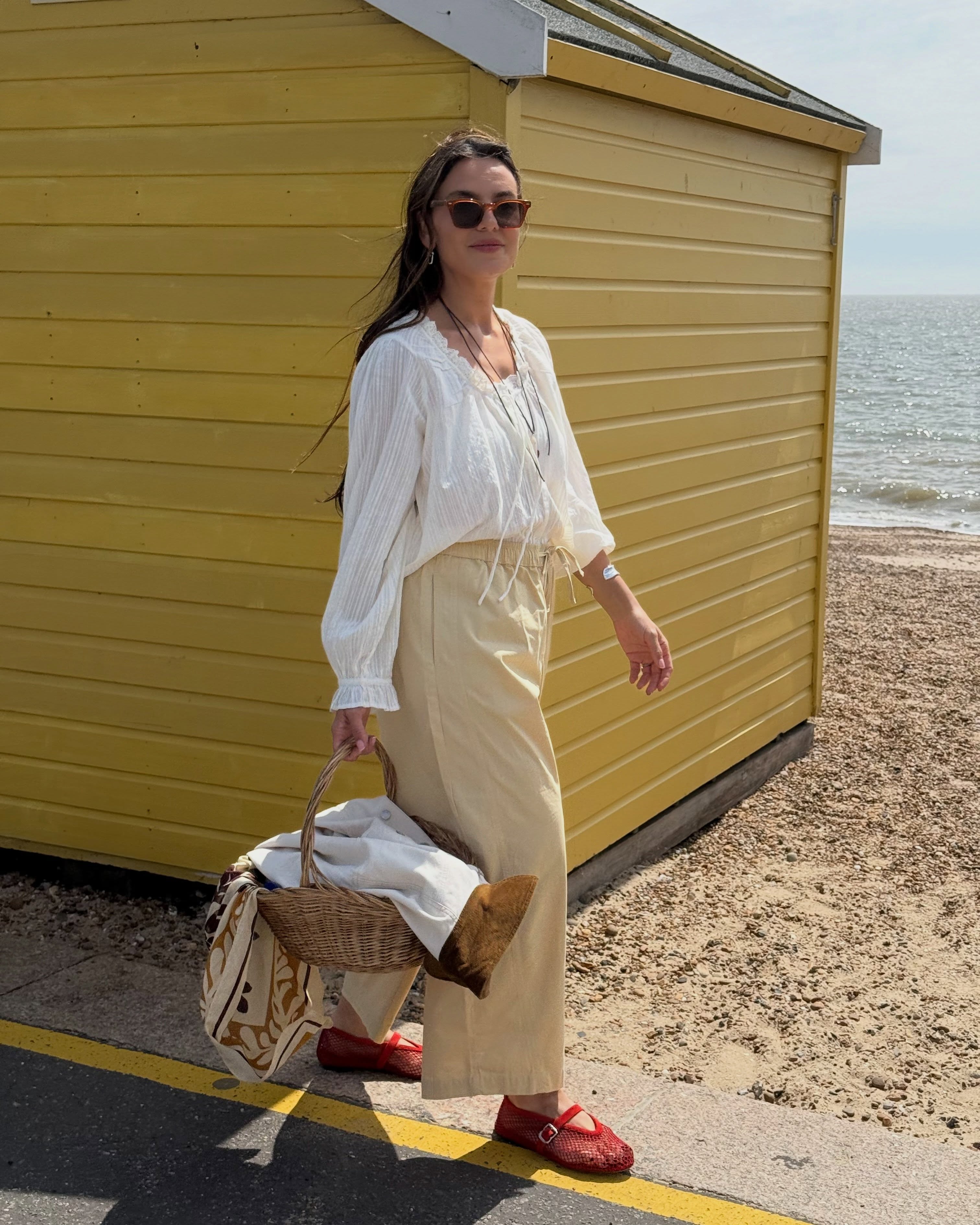 Influencer Claudia Berresford wearing barrel-leg trousers.