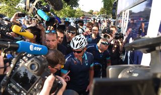 Lance Armstrong in a media scrum ahead of the One Day Ahead ride