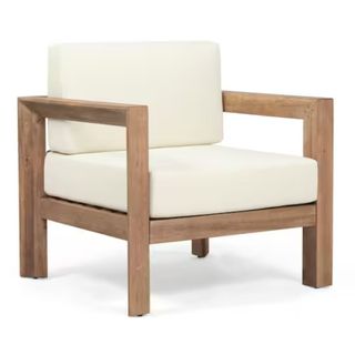 A wood outdoor armchair with white cushions from The Home Depot