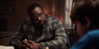 Child's Play Brian Tyree Henry talks to a child at a table