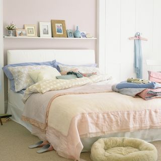bedroom with pet bed and white wall