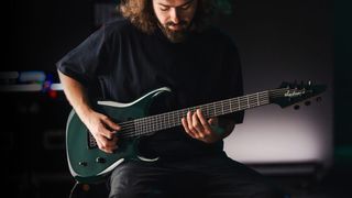 Roman Ibramkhalilov playing his signature Jackson guitar