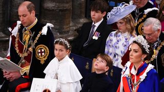 Prince William, Prince of Wales, Princess Charlotte, Prince Louis and Catherine, Princess of Wales attend the Coronation of King Charles III and Queen Camilla