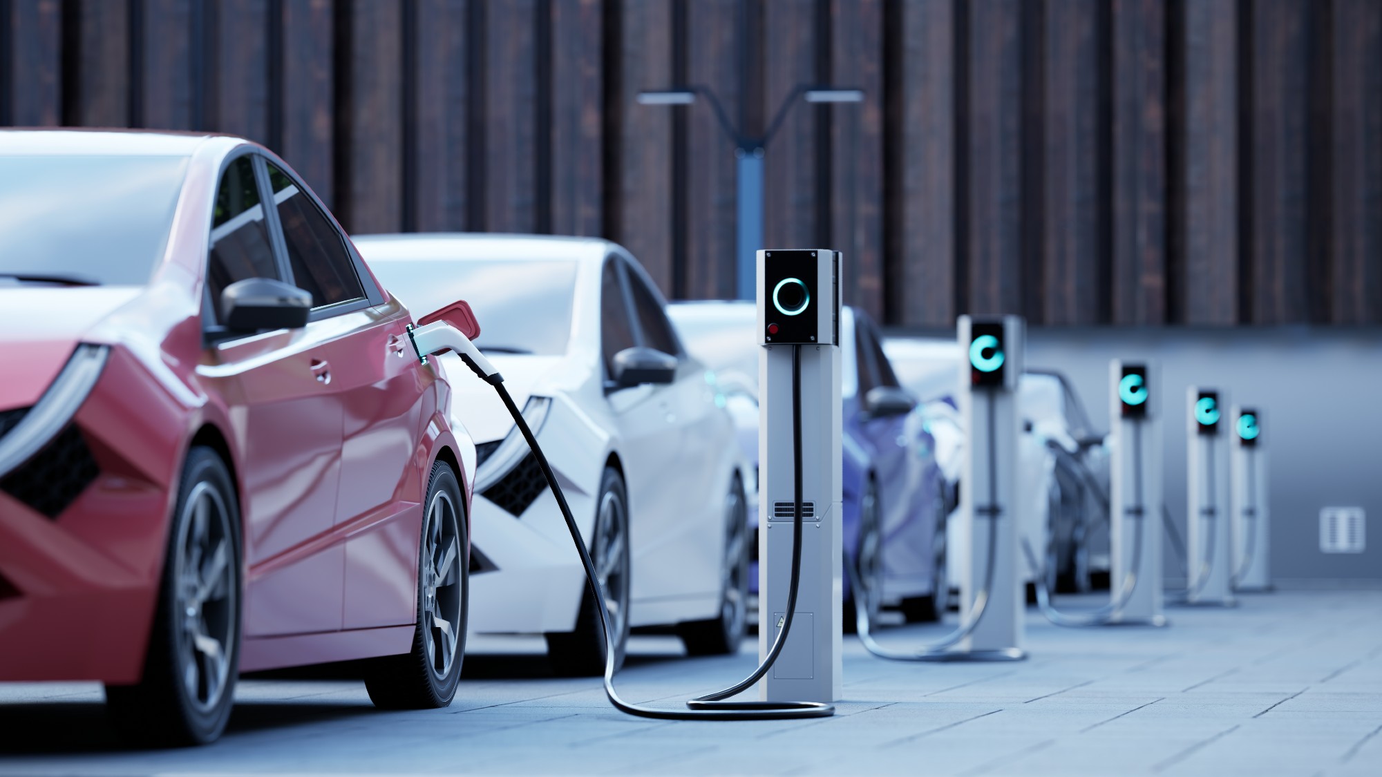 Row of electric cars charging on a city street