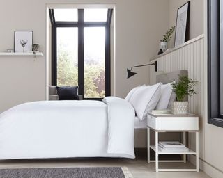 neutral bedroom with white bedding