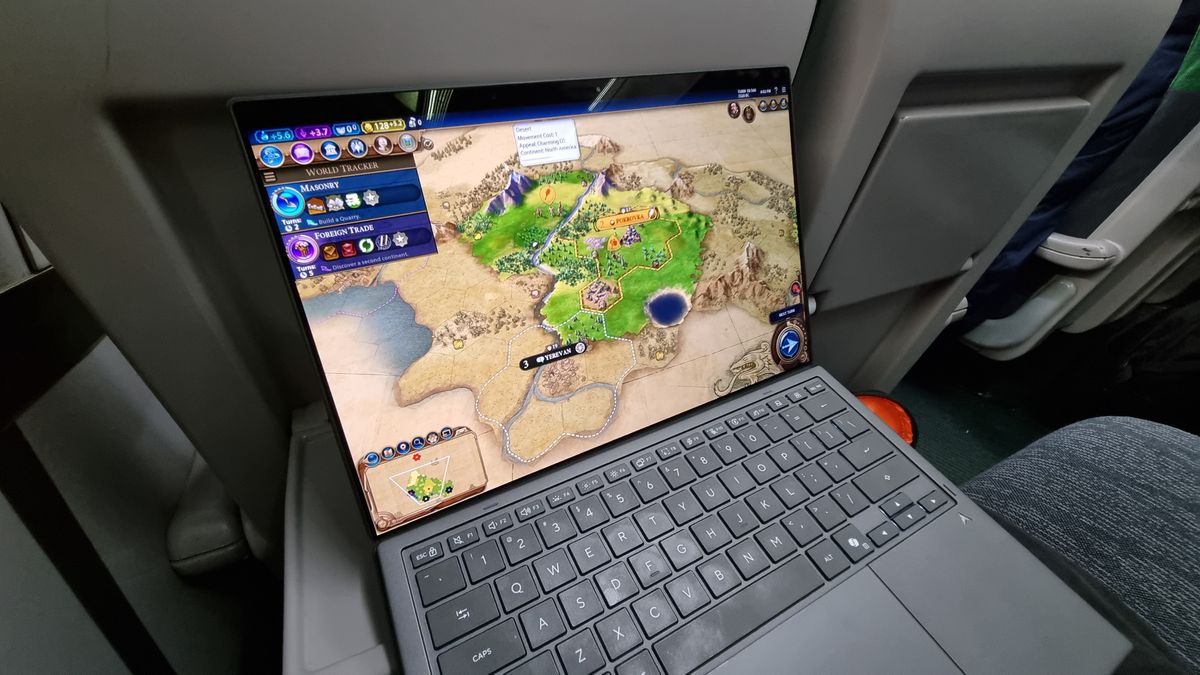 An Asus Zenbook Duo being used to play Civ 6 on a UK train on battery power alone