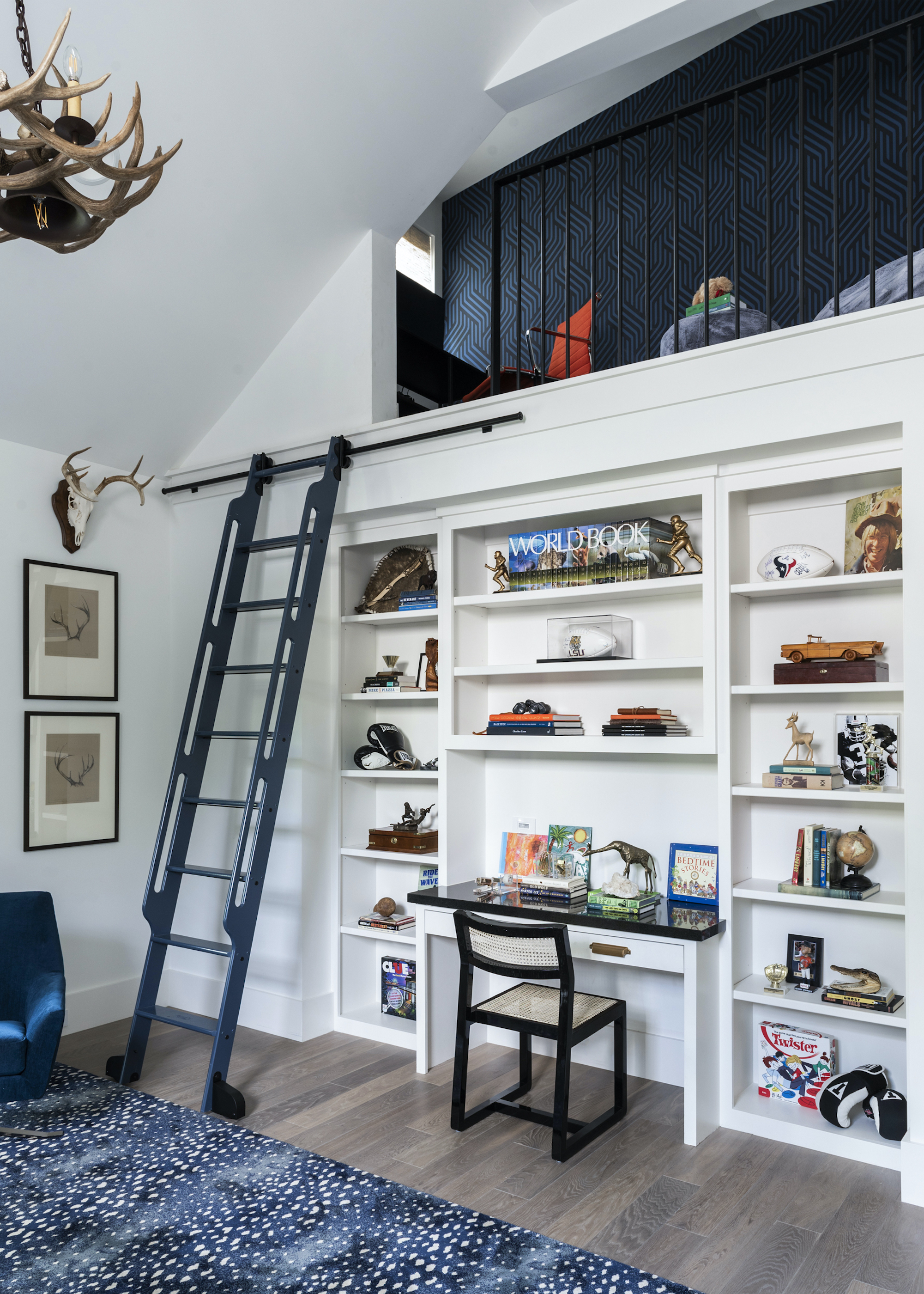 loft with mezzanine above and desk/bookshelves
