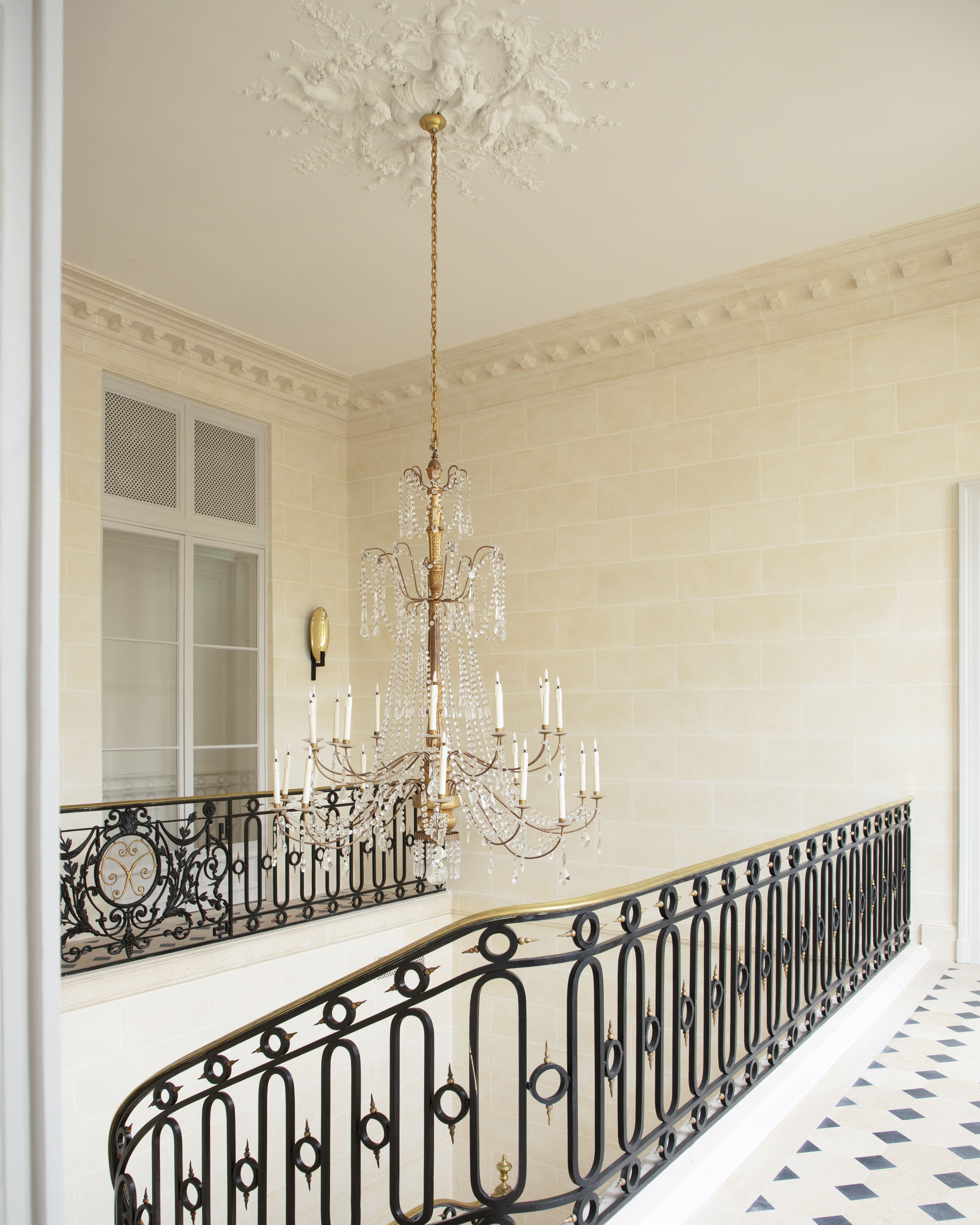 The various rooms of a palatial 18th-century residence have been restored into an art and antiques-filled fashion maison headquarters and archive.