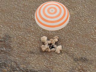 The Soyuz TMA-19 spacecraft with Expedition 25 Commander Doug Wheelock and Flight Engineers Shannon Walker and Fyodor Yurchikhin touches down near the town of Arkalyk, Kazakhstan on Friday, Nov. 26, 2010. They were returning from six months onboard the In