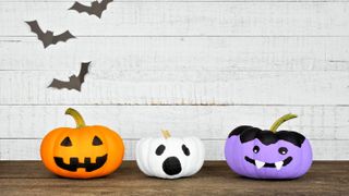 Felt designed faces on Halloween pumpkins