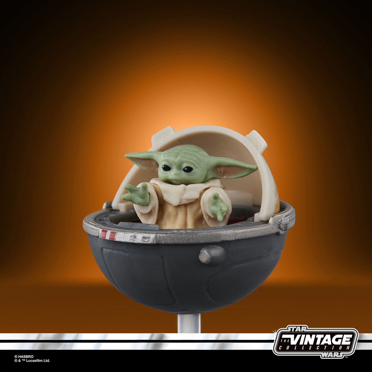 The Vintage Collection Grogu figure on an orange and black background