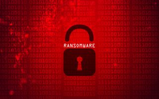IBM: Mockup image of ransomware - a red background with binary code and a padlock in the middle with 'ransomware' written on top of it