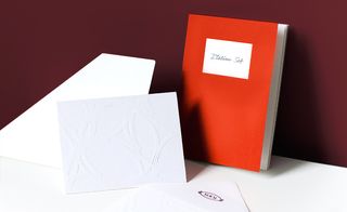 The invite and matching envelope came de-bossed with an abstract circular pattern