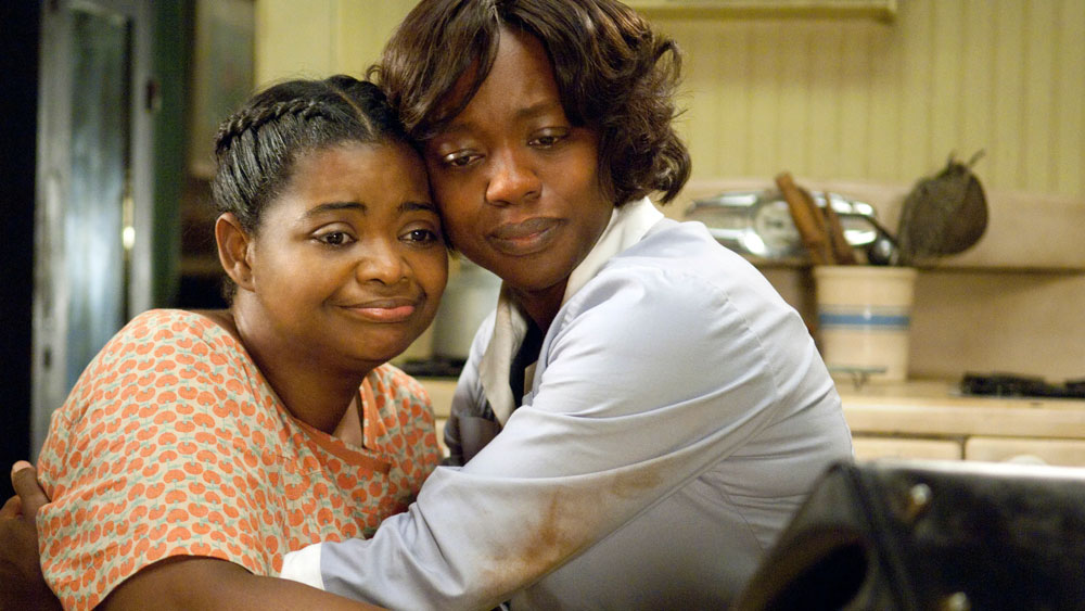 Viola Davis and Octavia Spencer hug in the movie The Help