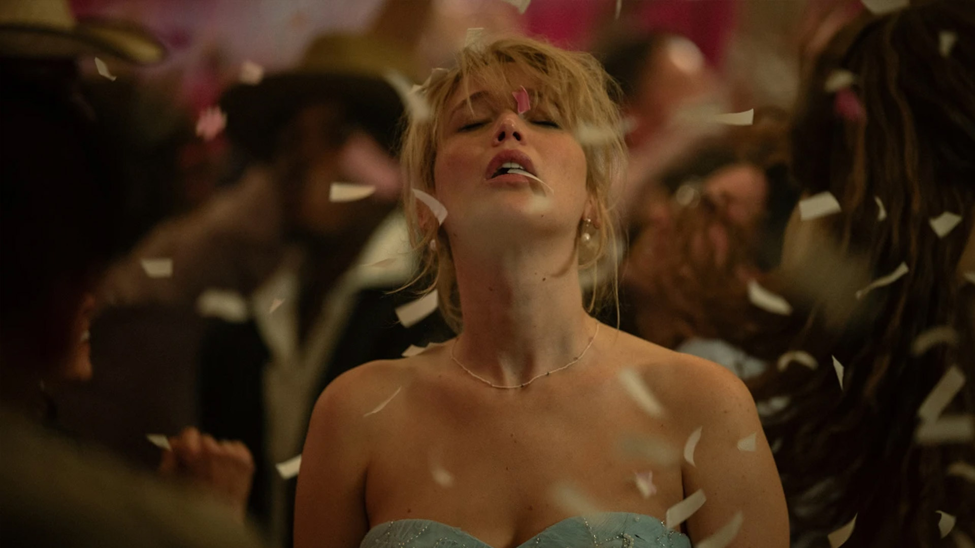 Jennifer Lawrence dances under confetti in the movie Die, My Love