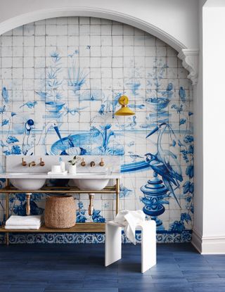 Blue and white bathroom tile idea with gold accents