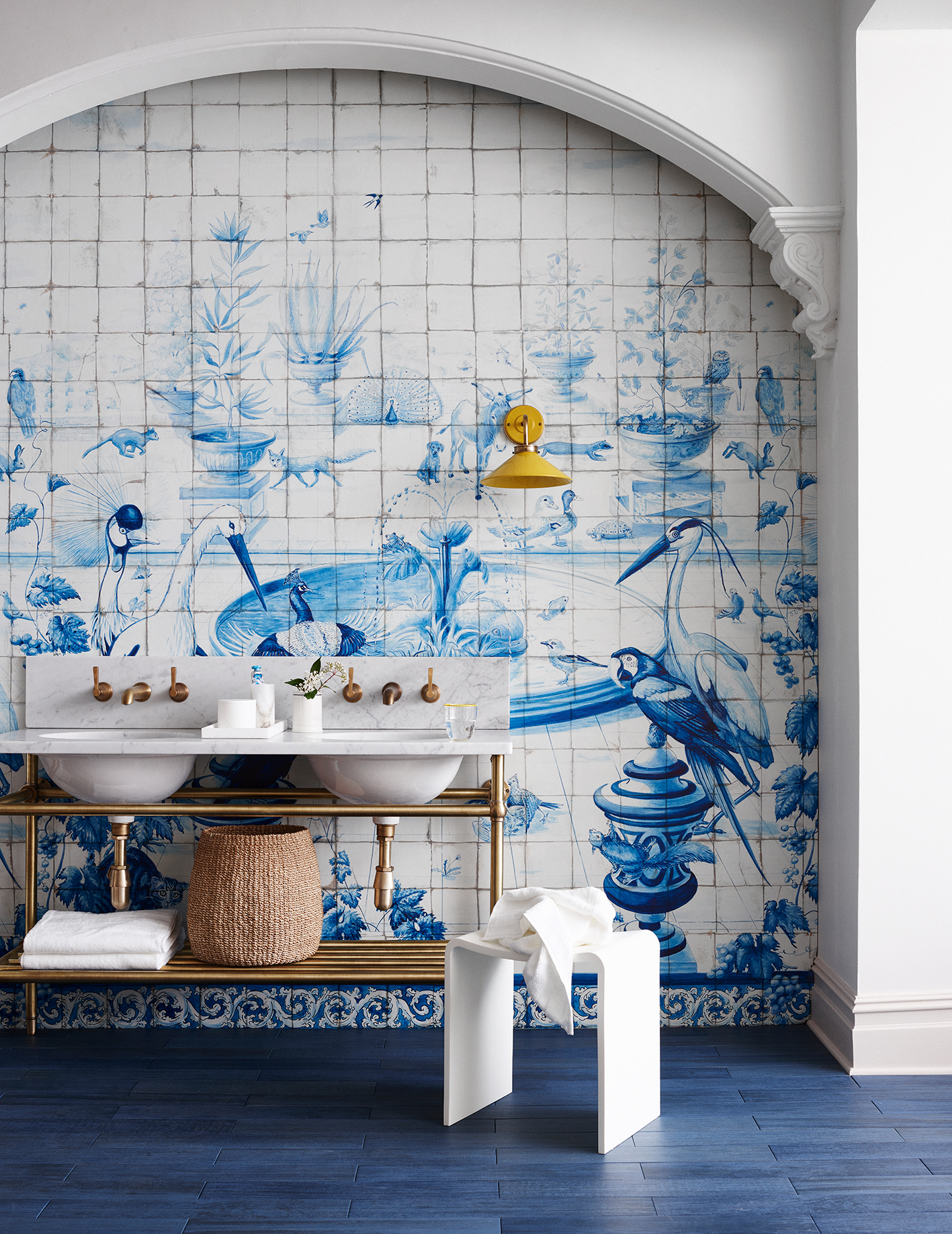 Blue and white bathroom tile idea with gold accents