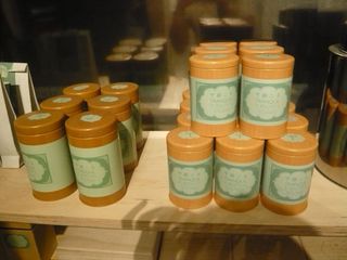 Tins of tea stacked on a shelf