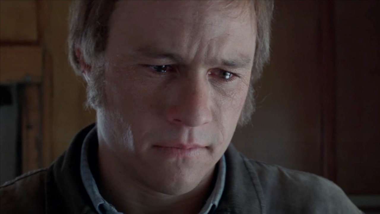 Ennis looking forward with tears in his eyes.