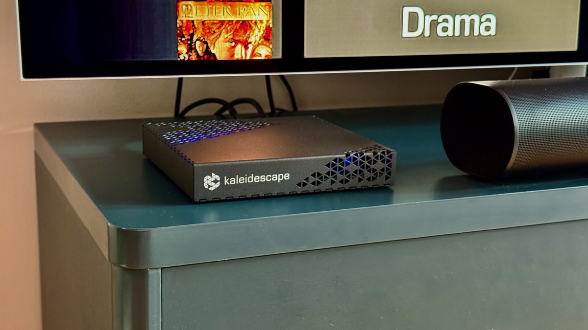 Kaleidescape Strato E Movie Player on a blue TV unit.