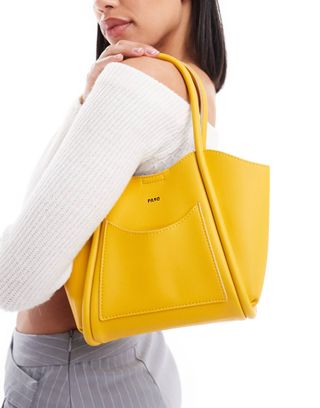 Bolso de mano pequeño con bolsillo delantero de Pasq en amarillo
