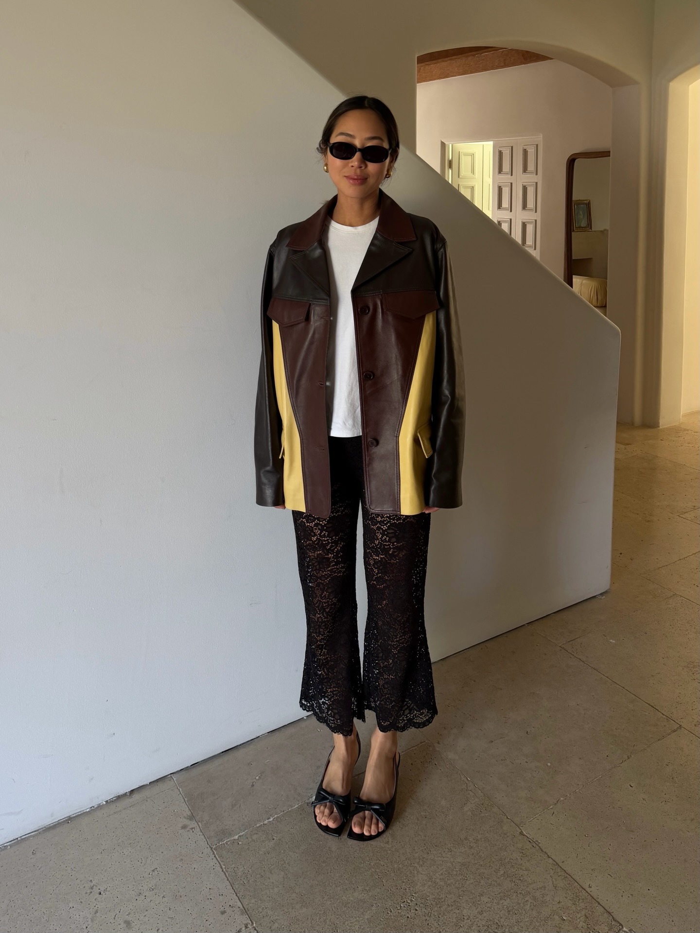 Influencer wearing cropped sheer lace pants with sandals
