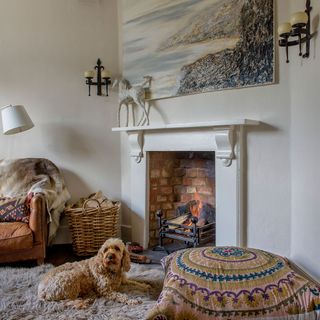 living room with fire place and wall painting