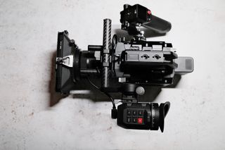 Blackmagic Pyxis 6K camera with lens attached on a white table