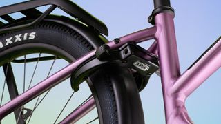 A purple frame against a coloured background highlighting an integrated bike lock