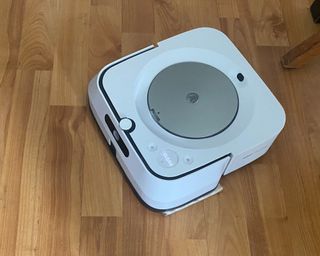 Image of iRobot Bravaa Jet m6 on hardwood floor