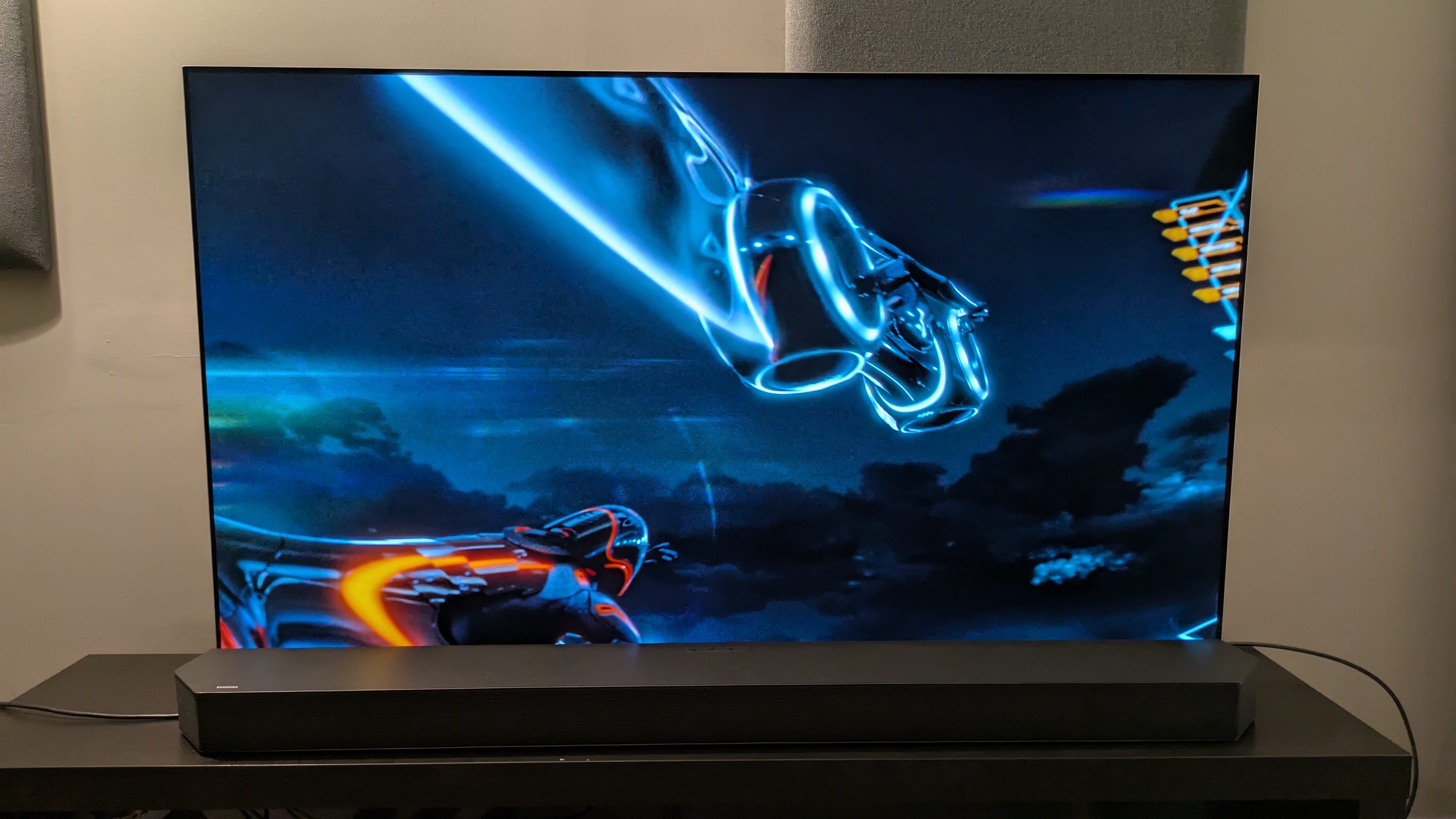 Tron: Legacy 4K Blu-ray on LG G5 showing light cycle mid-jump with trail behind