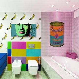 bathroom with bananas sticker on wall and tub